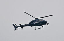 220px BBC News helicopter watching over the cuts protest