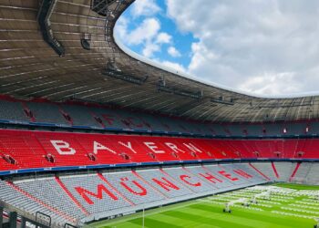 red and white stadium under blue sky during daytime
