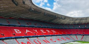 red and white stadium under blue sky during daytime
